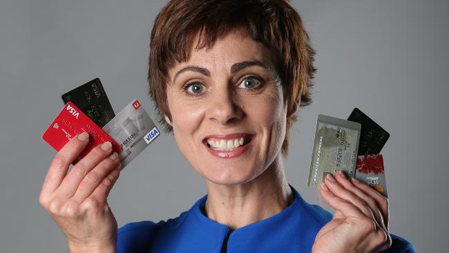 Heidi Armstrong holding up credit cards