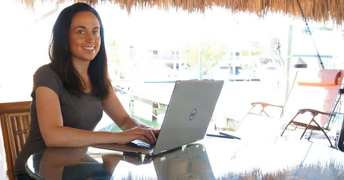 Amy Morin Writing Book On Laptop