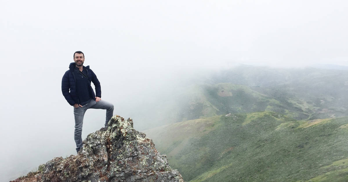 Yaro climbing foggy mountains in San Francisco